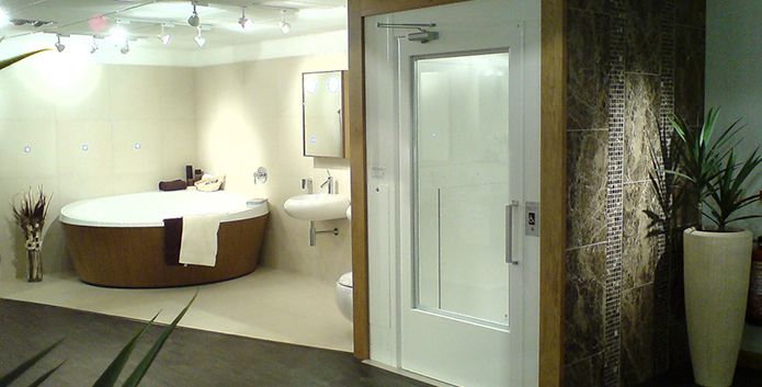 An enclosed platform lift used in a spa area