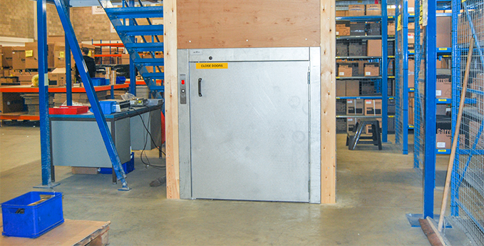 Closed trolley lift used in a warehouse environment