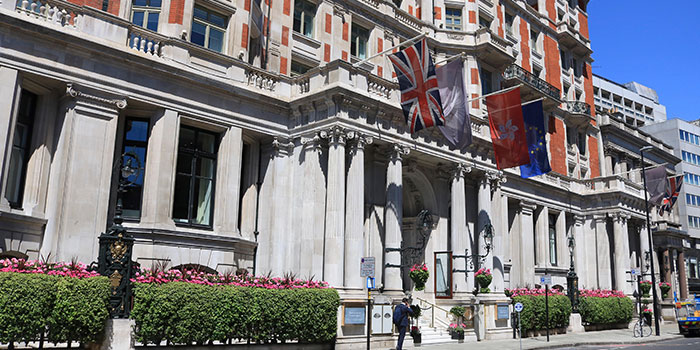 Outside view of the Mandarin Oriental Hotel with flags