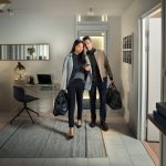 Couple walking out of an Artico home lift